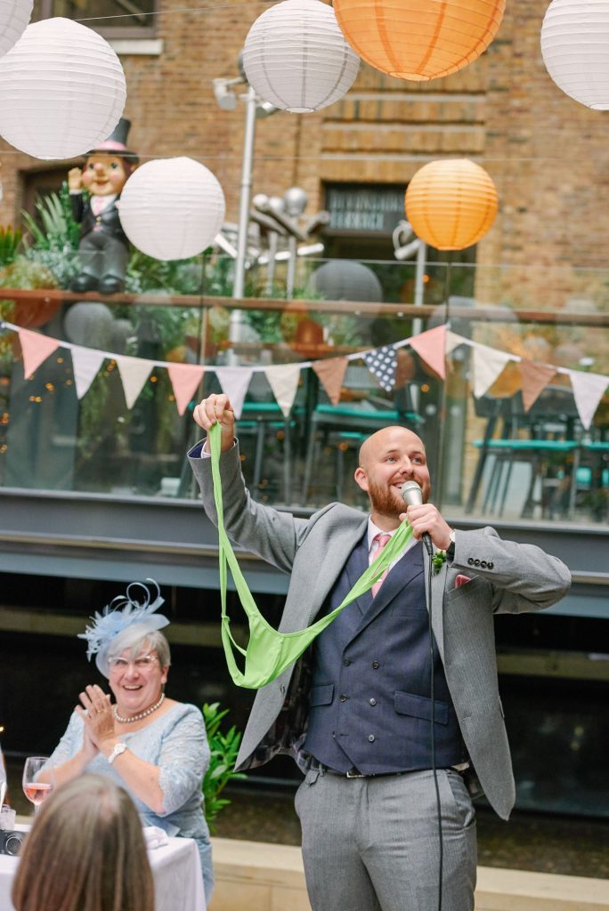 funny best man holding a mankini during speeches at Devonshire Terrace