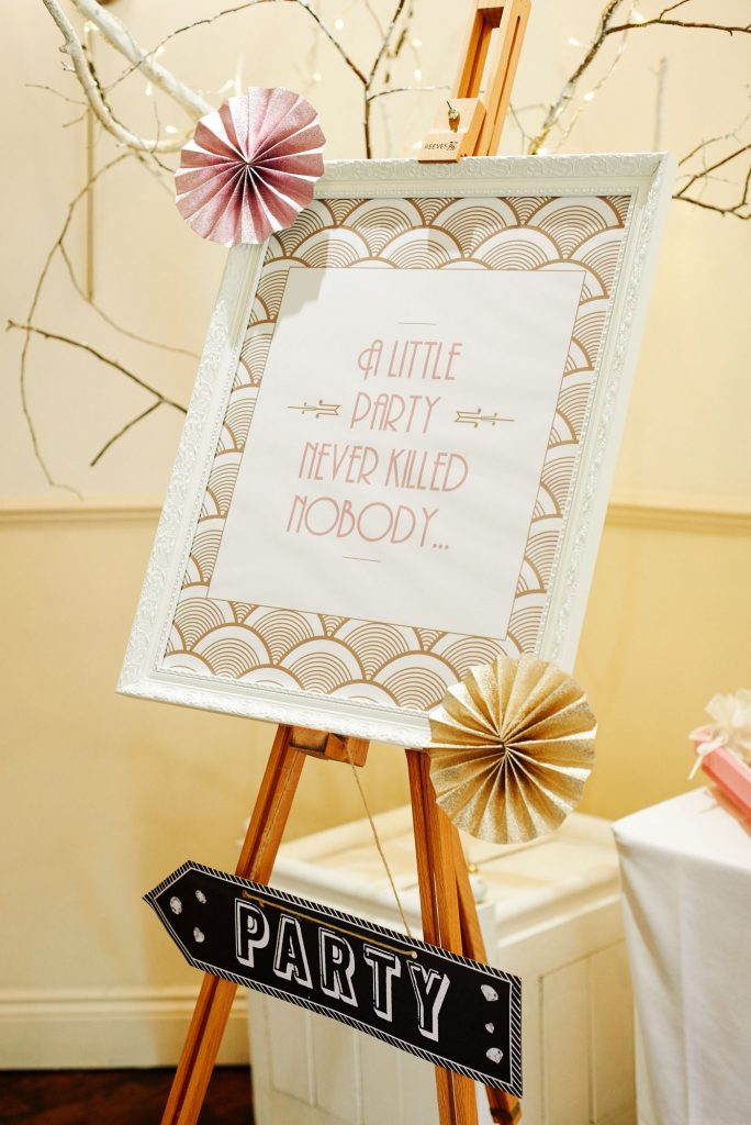 Great Gatsby style wedding party sign with gold and pink fans
