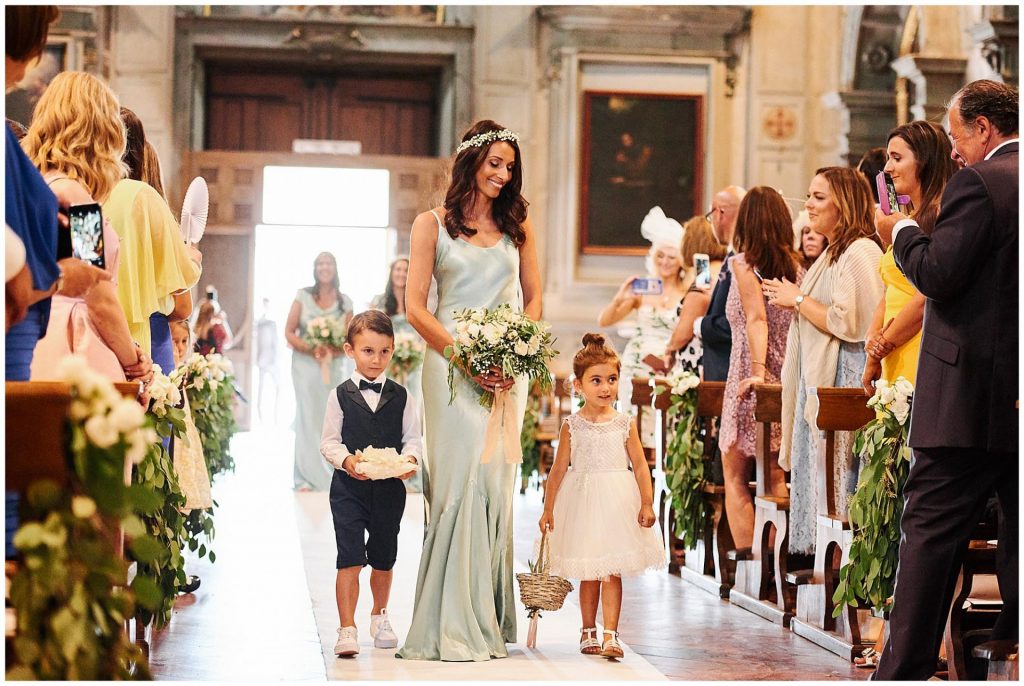 Bridesmaid wearing mint green during wedding ceremony at Ognissanti Church