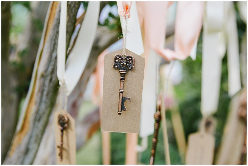 Find your seat Keys hung on trees with brown label name tags