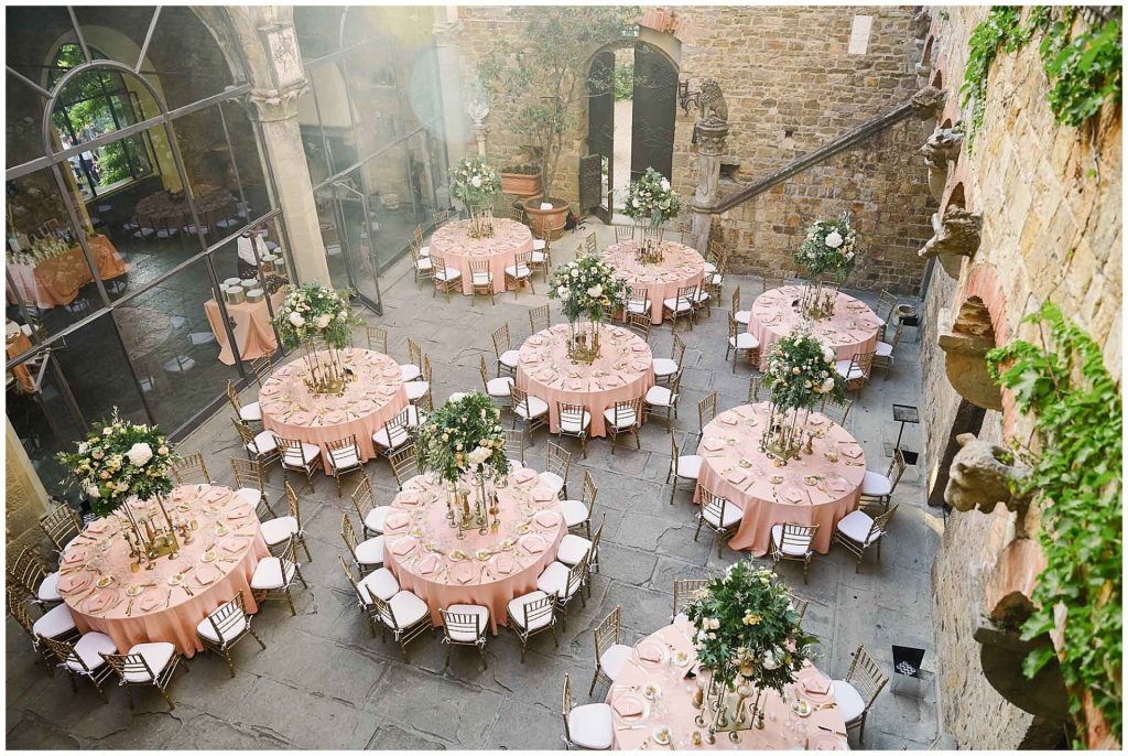Pink round wedding tables set up at Castello Di Vincigliata destination wedding