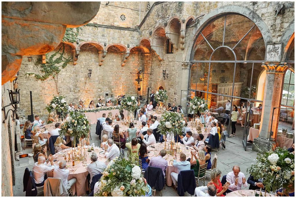 Wide shot of wedding reception dinner at Castello Di Vincigliata