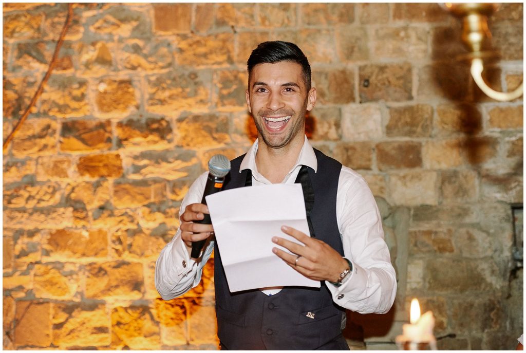 Groom giving a speech at his Castello Di Vincigliata destination wedding