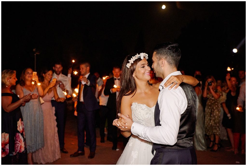 Bride and groom dancing outside at Castello Di Vincigliata destination wedding