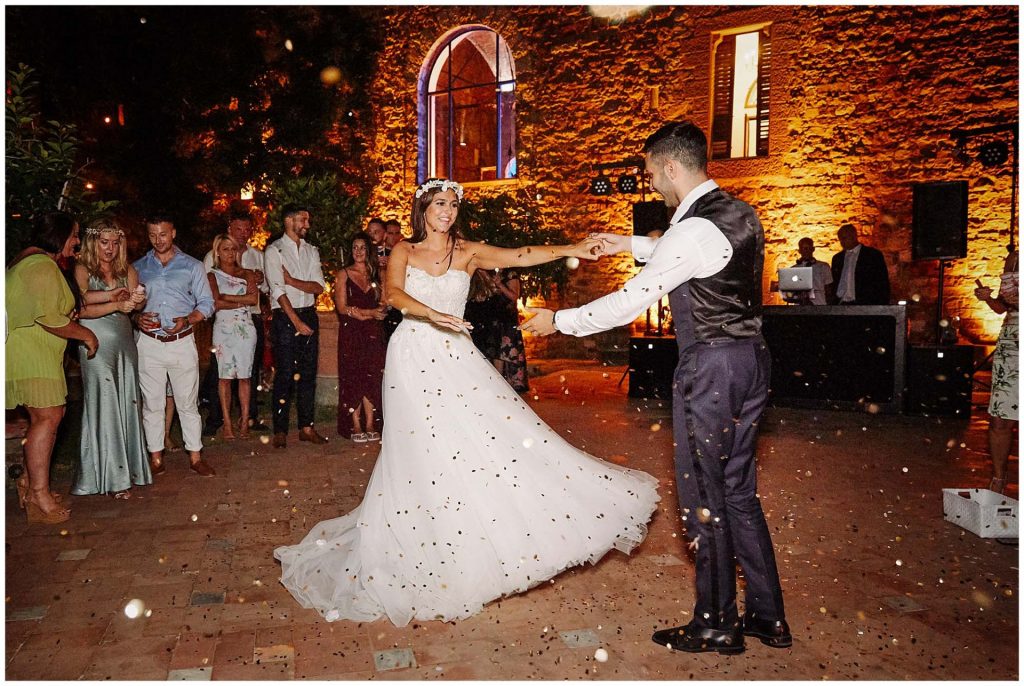 Bride and grooms first dance under confetti at Castello Di Vincigliata