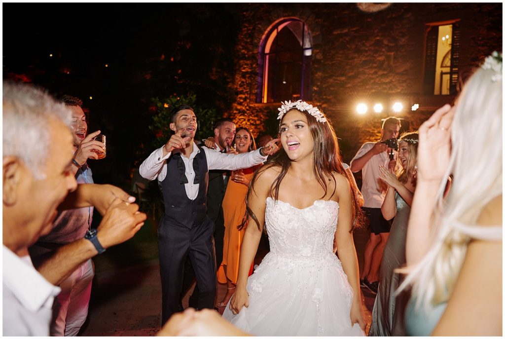 bride dancing during Castello Di Vincigliata destination wedding reception