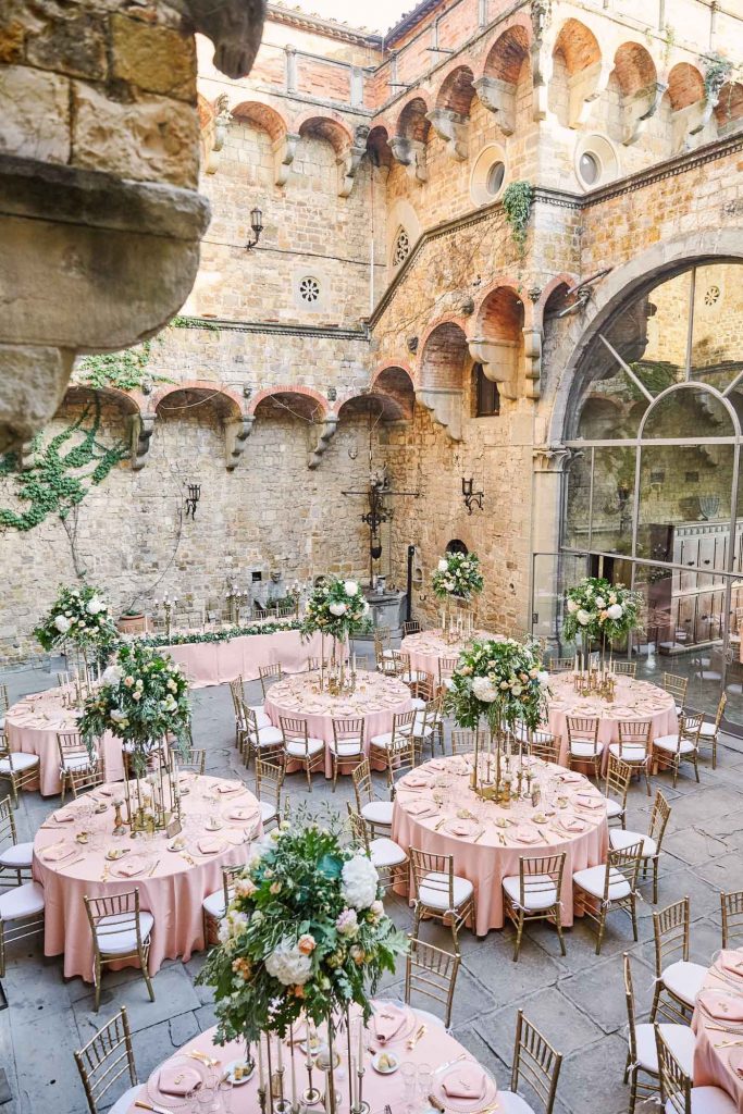 Pink round wedding tables set up at Castello Di Vincigliata wedding
