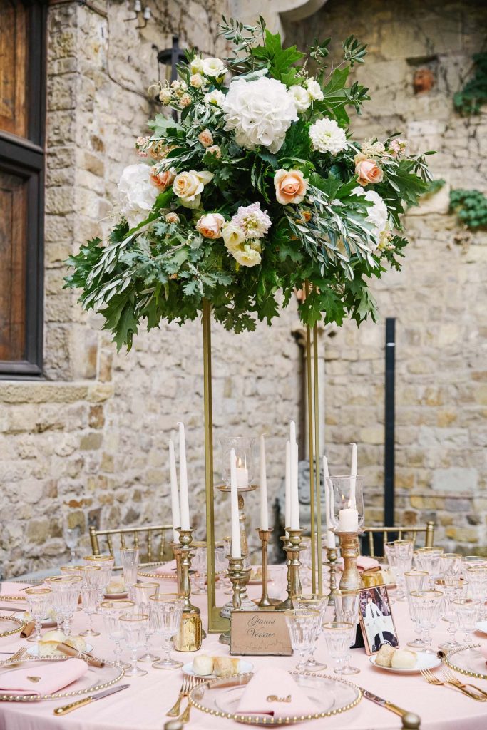 Pink table details with flower centre pieces at Castello Di Vincigliata wedding