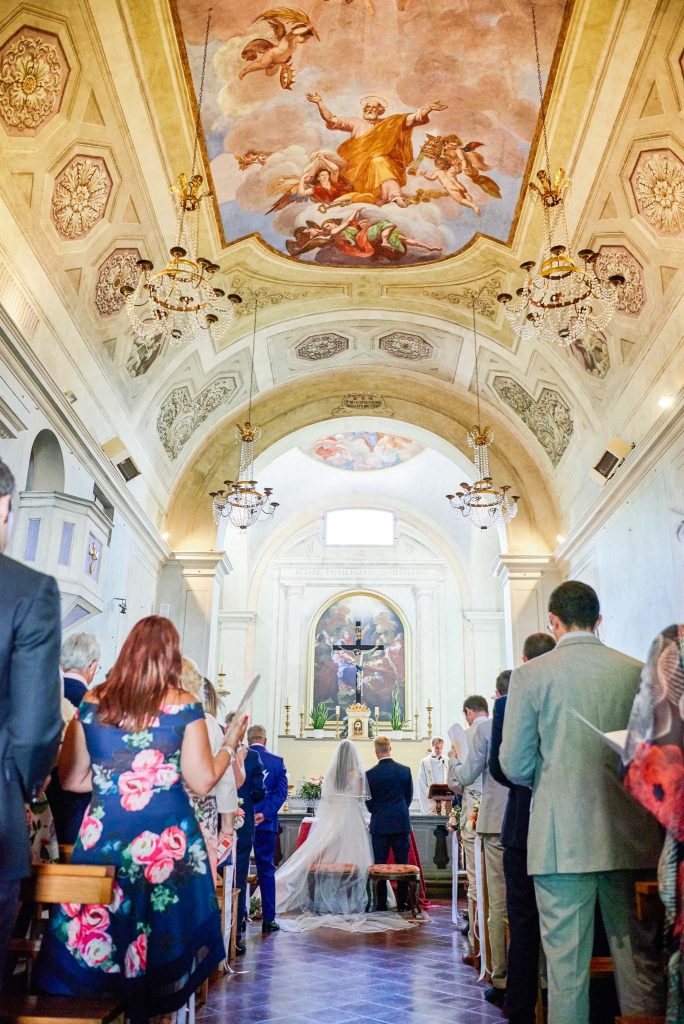 Bride and groom stood at the end of the alter at the Catholic Church of Careggi in Florence, Italy