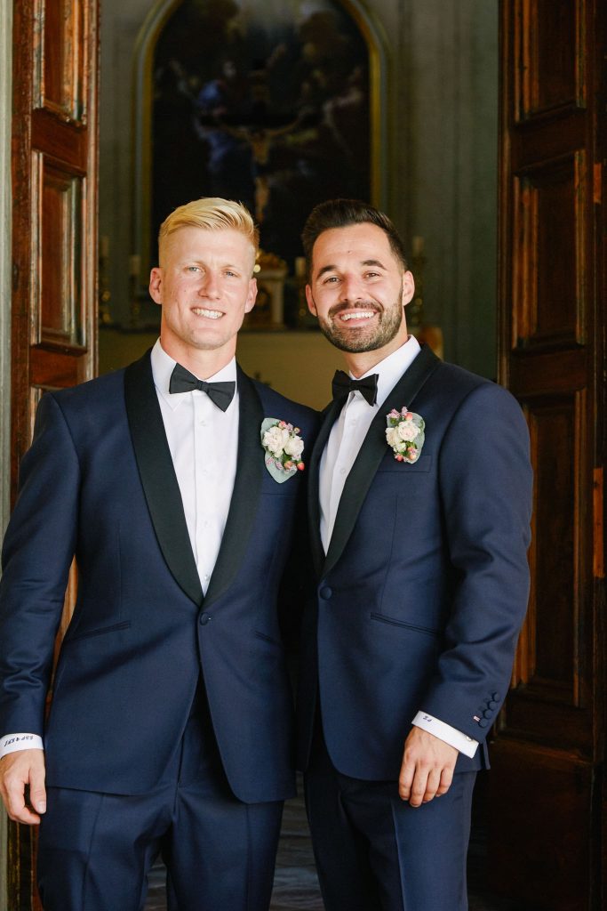 Groom and groomsmen smiling outside of the Catholic Church of Careggi in Florence, Italy 