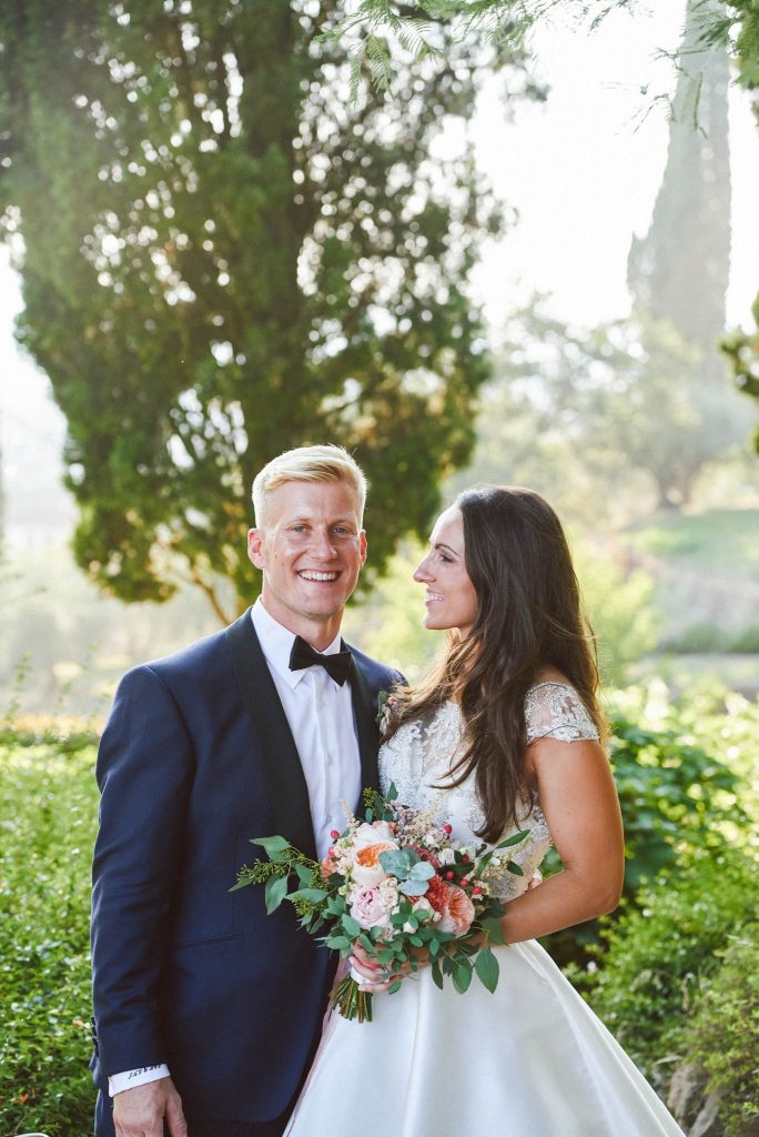 Bride and groom laughing during sunset at the villa le Fontanelle in Florence Italy 