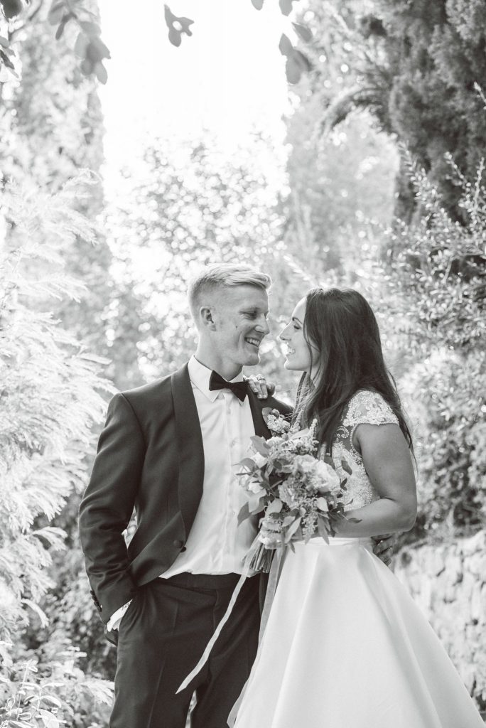 Bride and groom laughing together at the villa le Fontanelle in Florence Italy