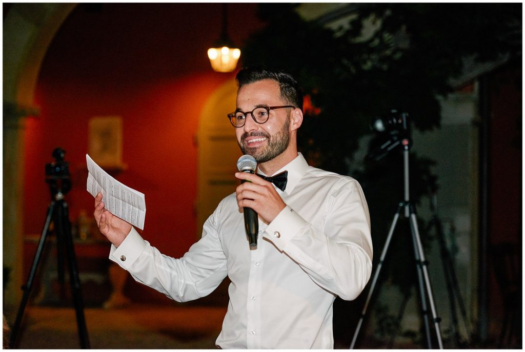 Best man laughing during his speech at Italian Destination Wedding