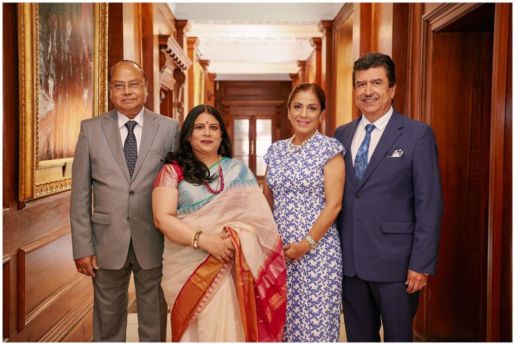 Indian and Mexican family members in the corridoor of Old Marylebone Town Hall 