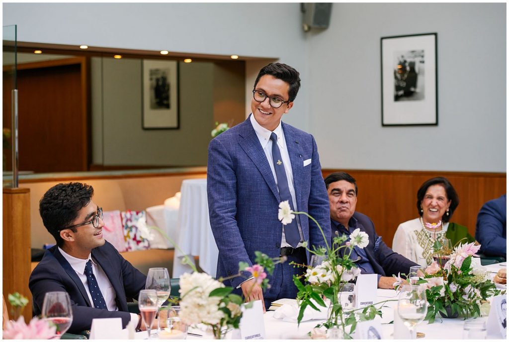 best man stood up and smiling during his wedding speech at The Bluebird in Chelsea