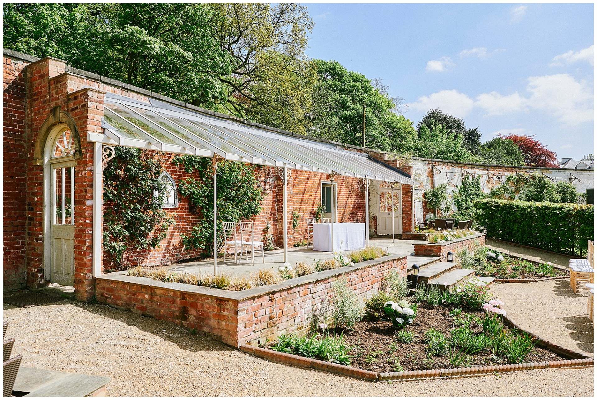Exterior view of the outdoor ceremony loggia at The Walled Garden in Beeston .