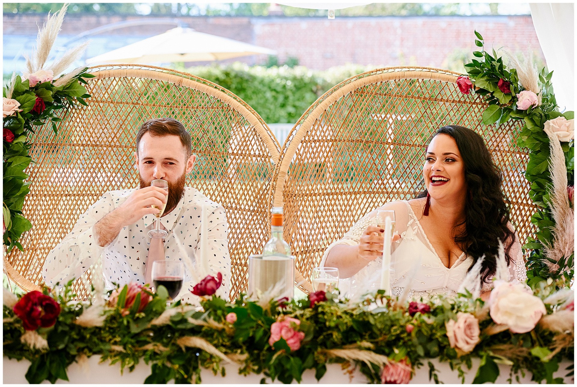 Wedding couple laughing during speeches at The Walled Garden in Beeston
