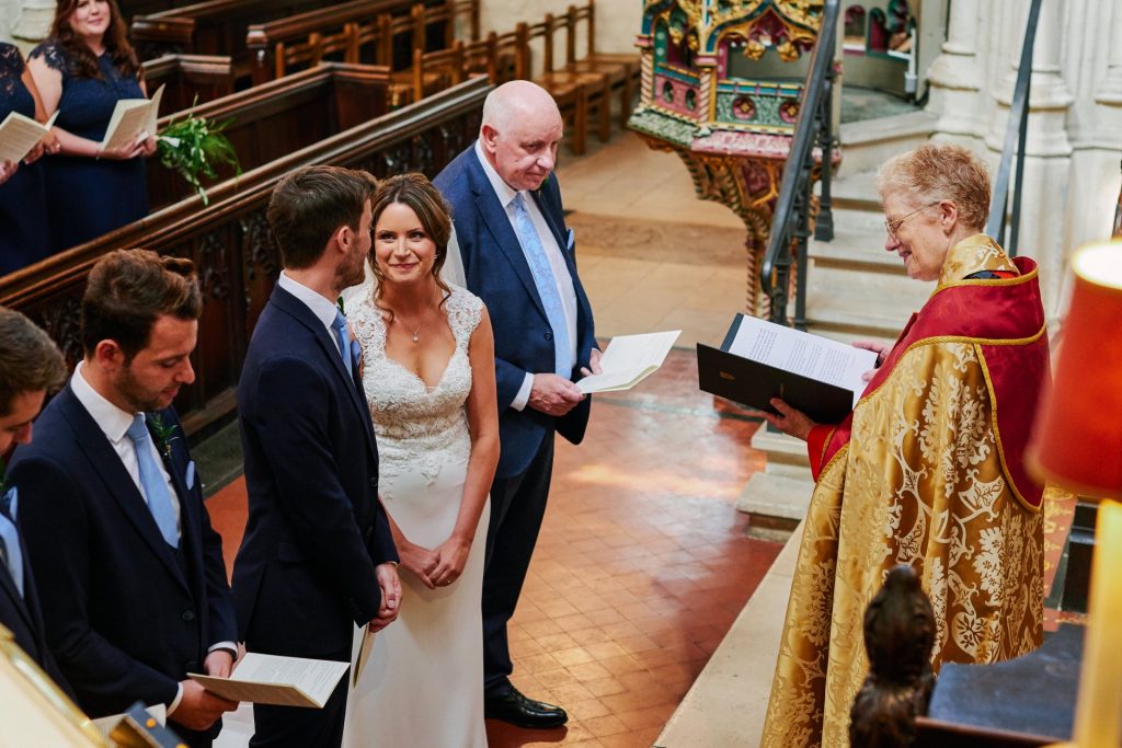 Bride and Groom during ceremony inside St Margaret's Church in central London