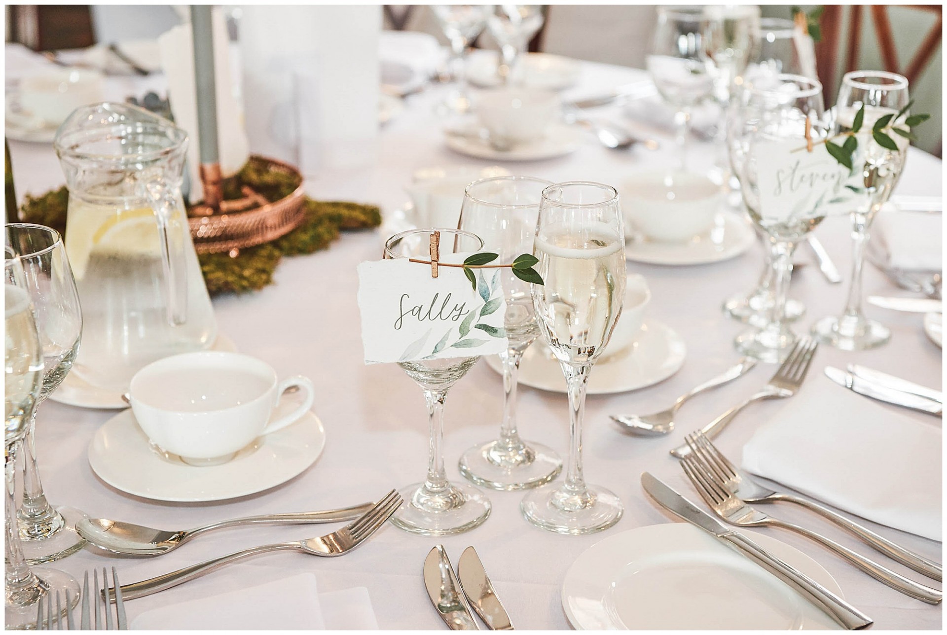 Wine glasses and stationary table details at the West Mill in Derby.