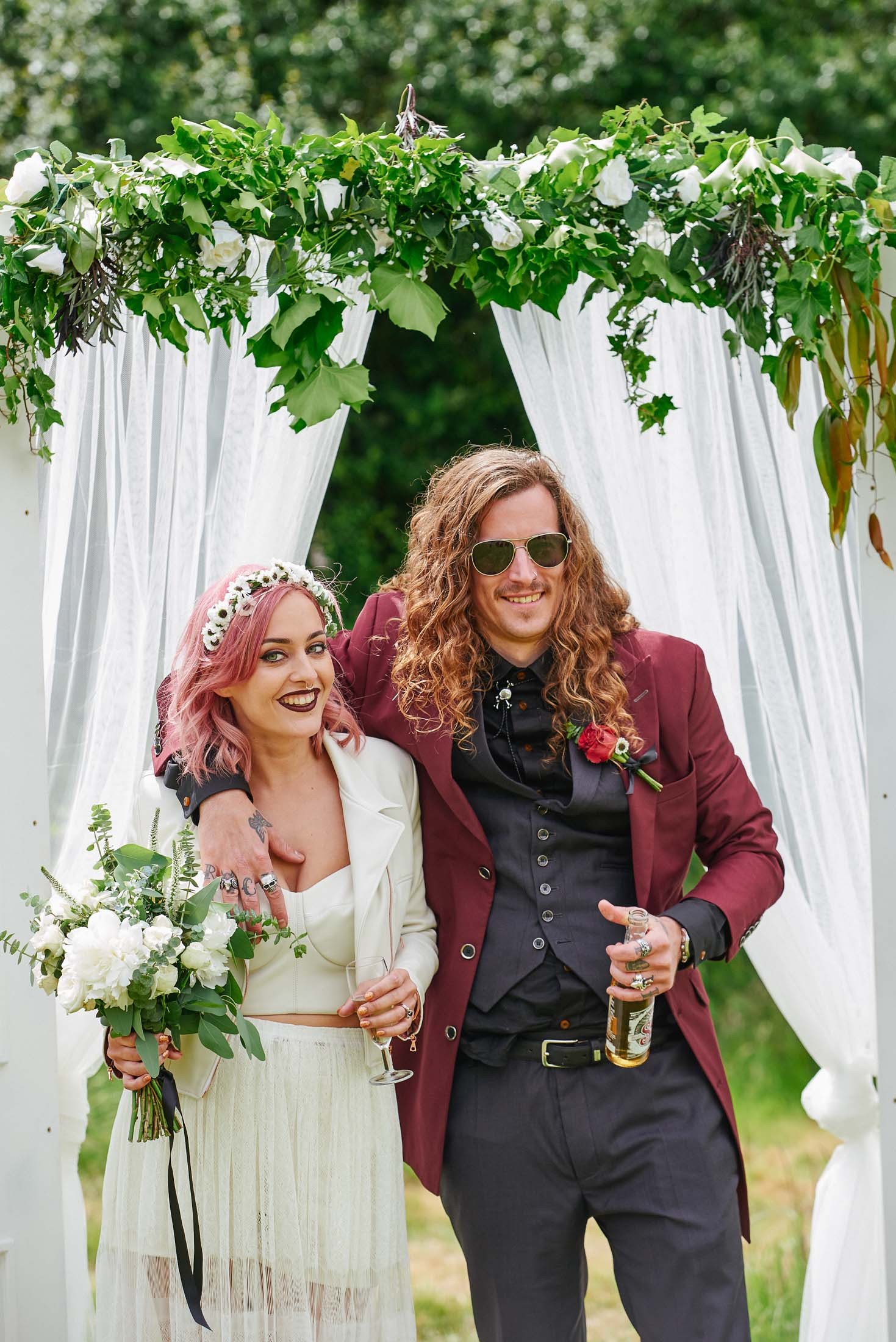 Bride and groom laughing together at their festival style wedding at The Pheasantry Brewery