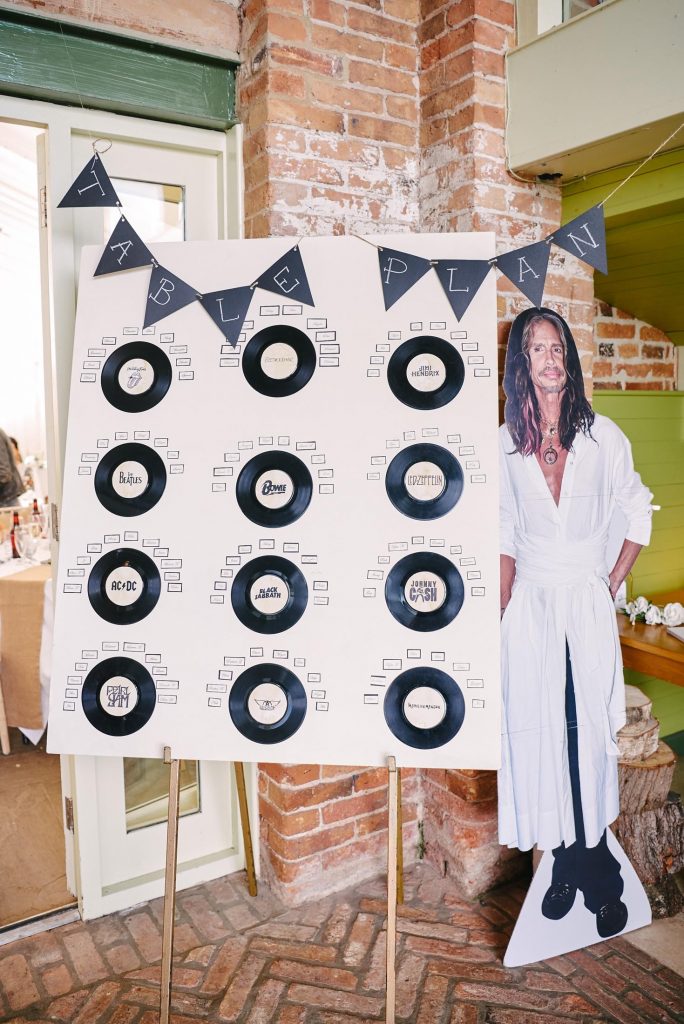 Rock n roll style table plan with Steven Tyler cardboard cut out.