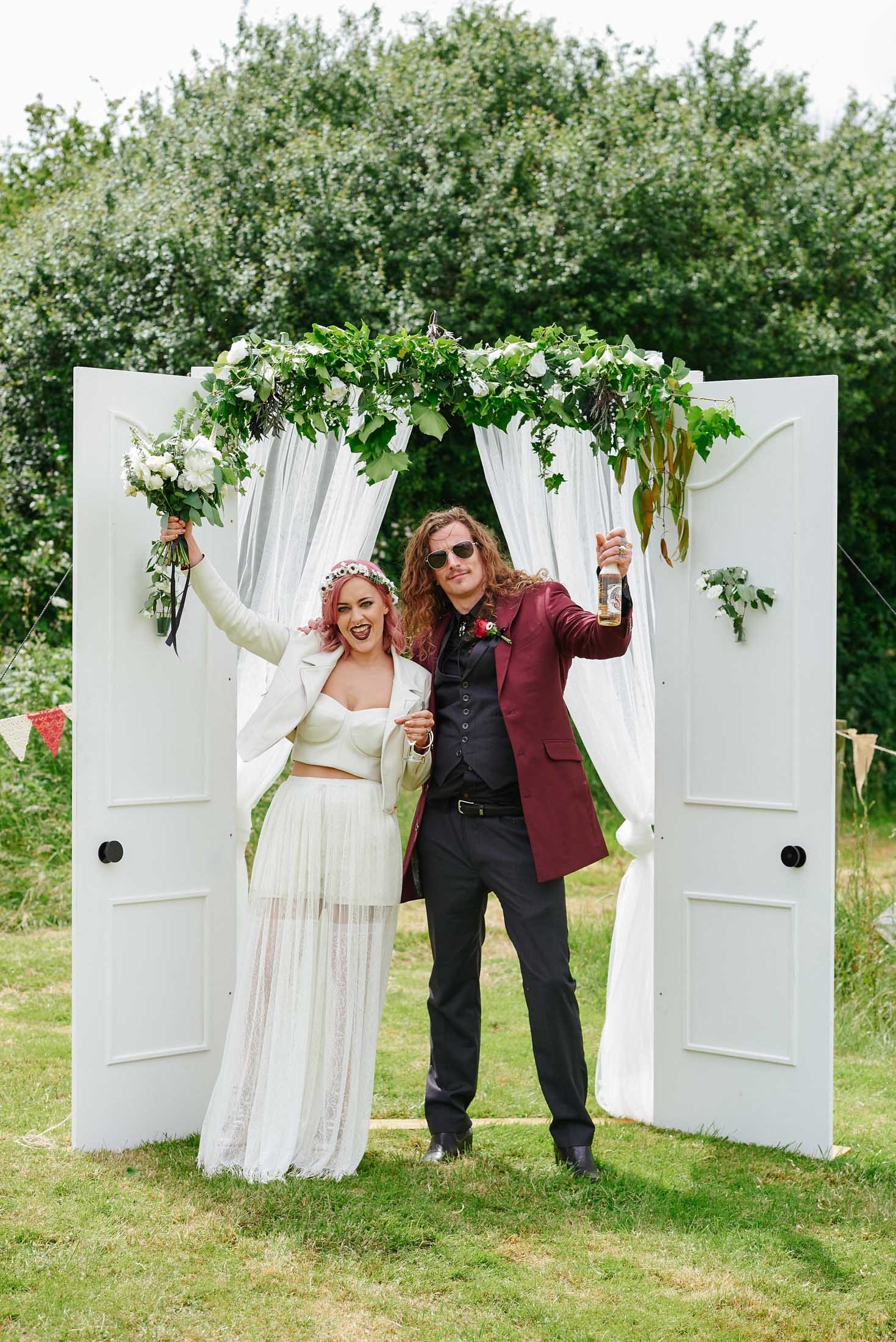 Bride and groom celebrating together at their festival style wedding 