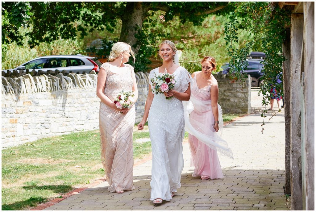 bride arriving at The Almonry Barn on her wedding day
