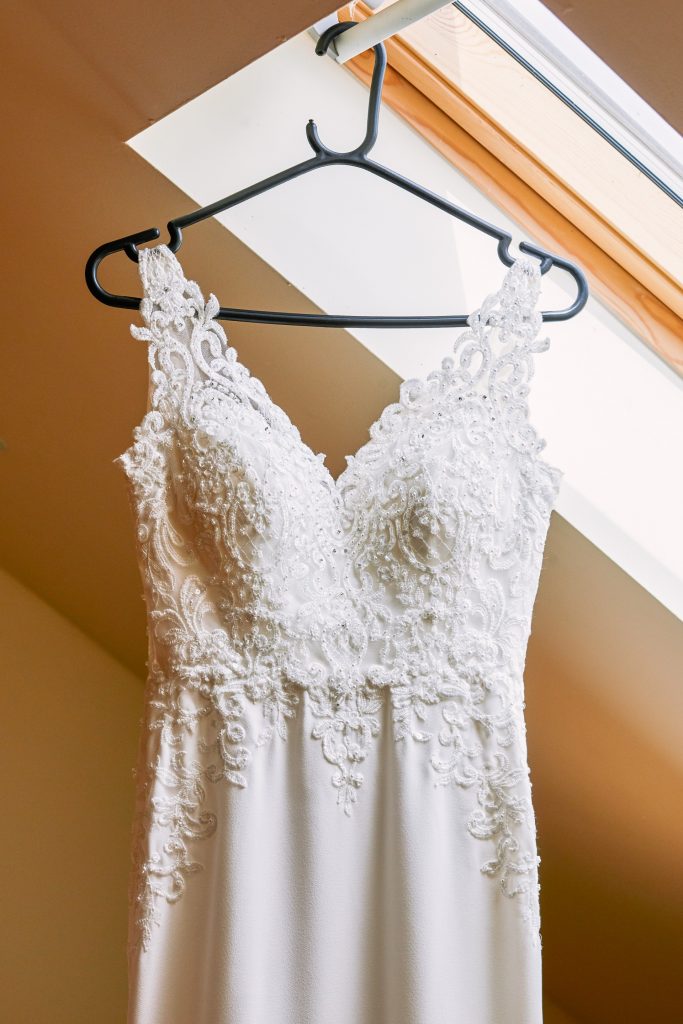 Beautiful wedding dress hung up at Micklefield Hall