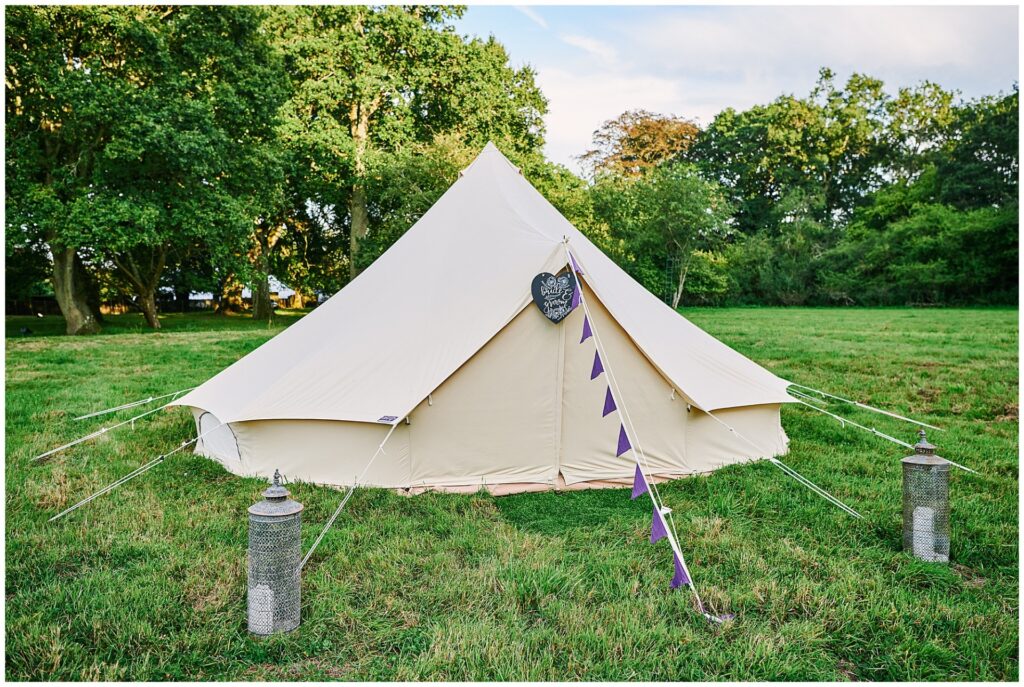 Festival bell tent set up for bride and groom at their Pamber Place summer wedding