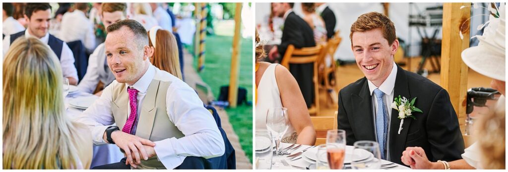 Happy wedding guests laughing in a marquee tent during Pamber Place wedding