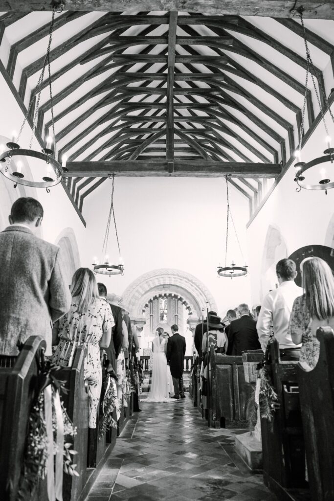 bride and groom at the end of the alter during wedding ceremony