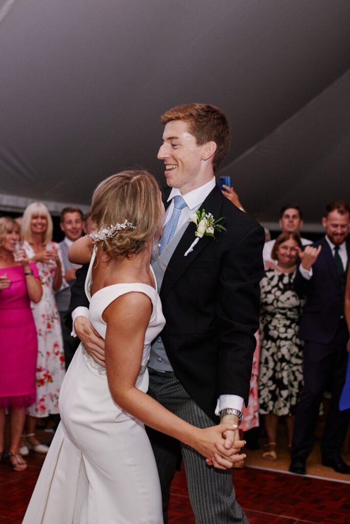 Bride & groom dancing during evening marquee reception at Pamber Place