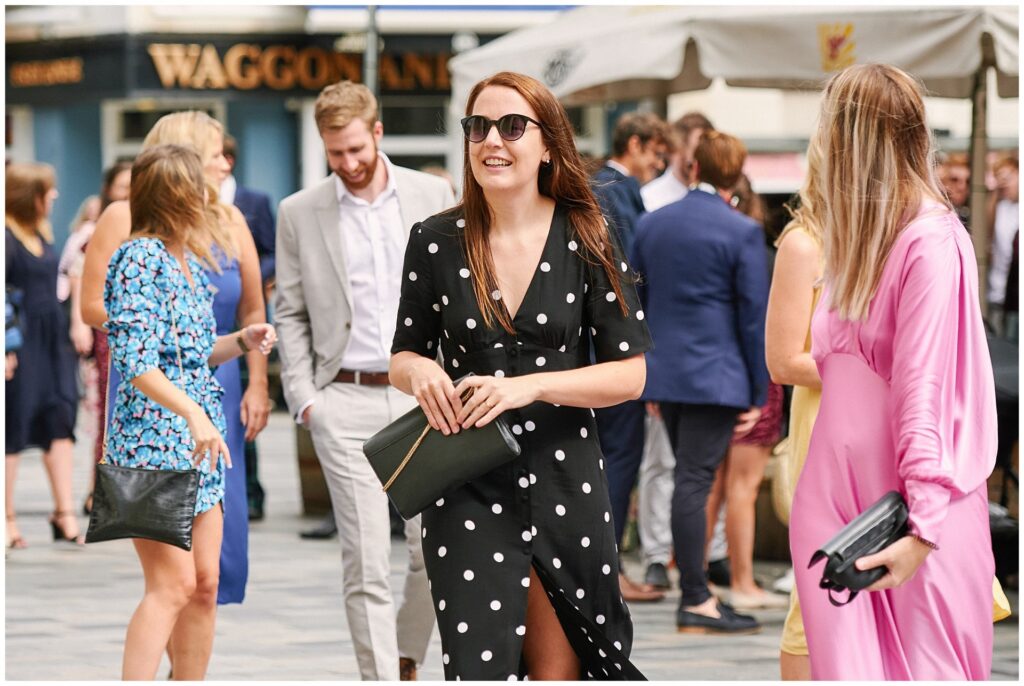 Guests arriving at wedding on a sunny day in Brighton 
