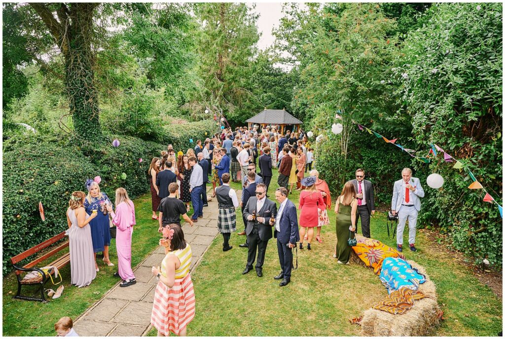 Guests enjoying summer garden party wedding reception in Brighton
