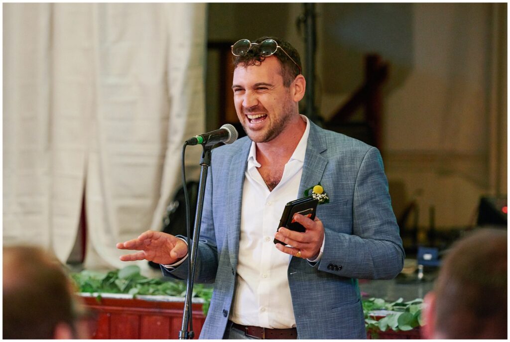 Brides cool brother giving a speech at Brighton wedding reception. 