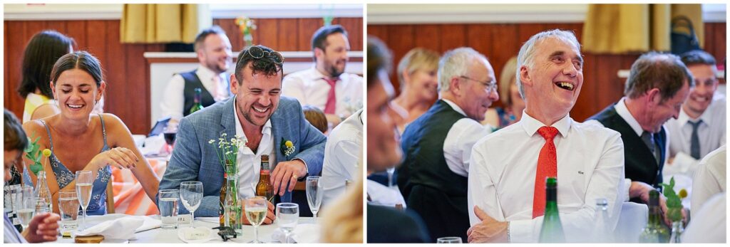 Guest laughing during wedding dinner speeches in Brighton. 