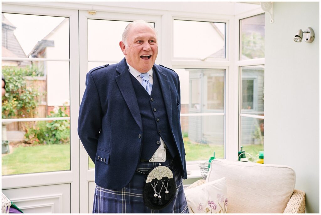 farther of the bride looking shocked after seeing his daughter