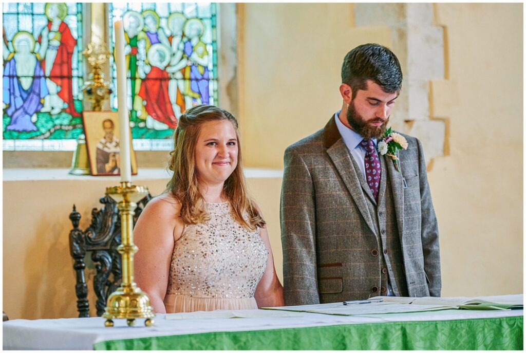 Bride and groom smiling after singing the register at their wedding in Essex