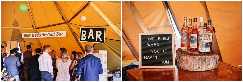 Wedding guests enjoying the bar inside a tipi festival tent in Essex