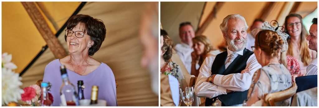 wedding guests laughing during speeches inside a festival tipi tent