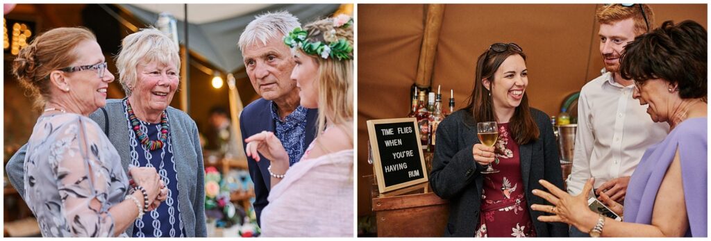 relaxed wedding guests laughing at tipi wedding in Essex