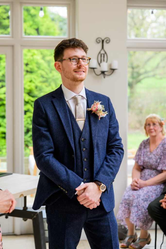 groom waiting for bride during orangery ceremony woodborough hall