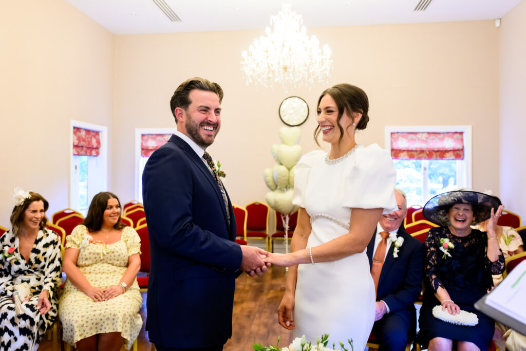 Bride & groom laughing during West Bridgford Registry Office wedding