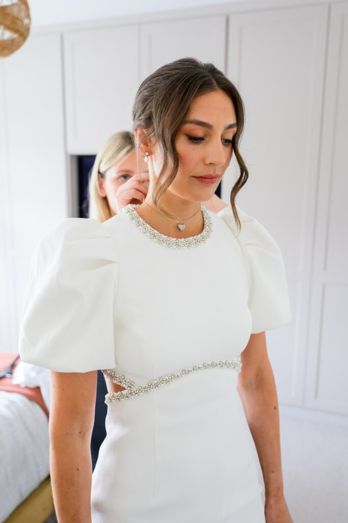 Bride in modern wedding dress getting ready before her Nottingham wedding ceremony