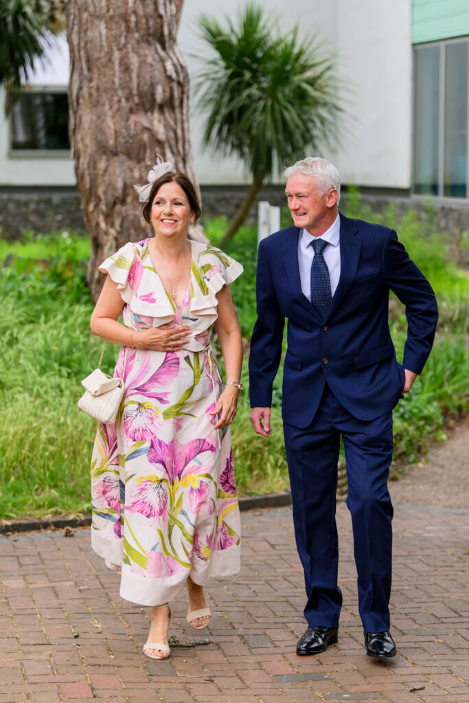 Wedding guests arriving outside in West Bridgford park