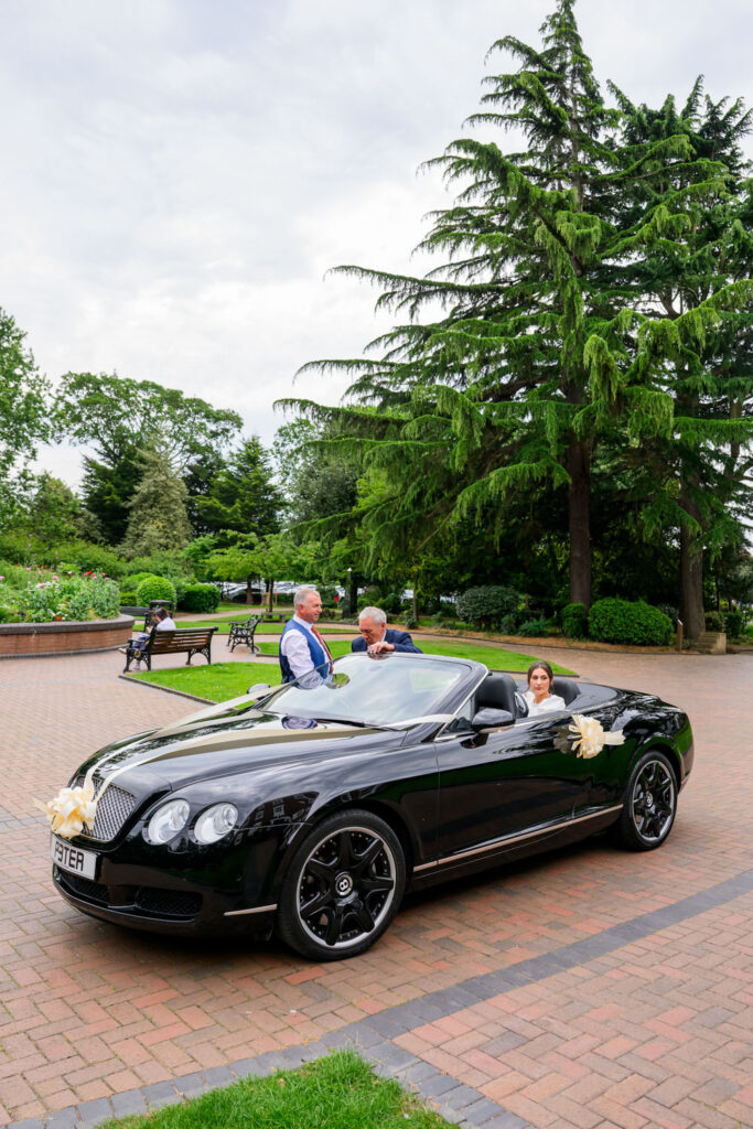Bride and groom arriving at West Bridgford Registry Office in a black Bentley