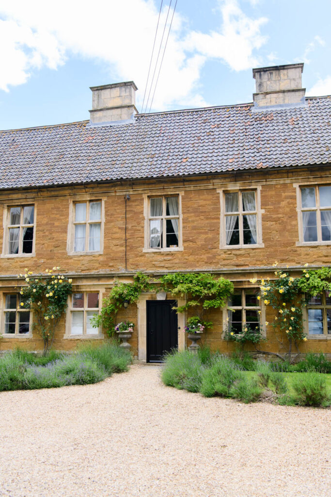 Entrance to Allington Manor wedding venue in Lincolnshire with ivy-covered stone building