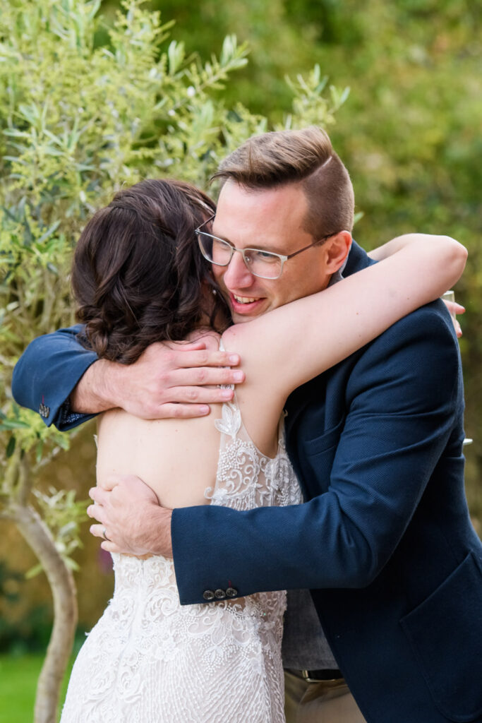 Wedding guest hugging the bride during drinks reception at Allington Manor