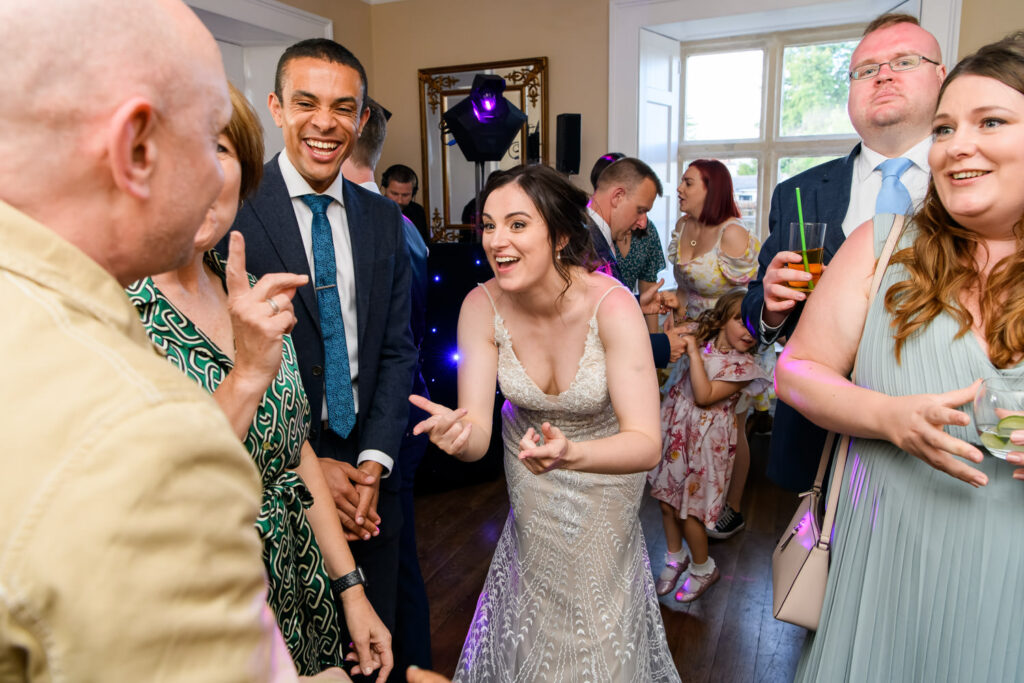 Guests dancing and celebrating on the wedding dance floor