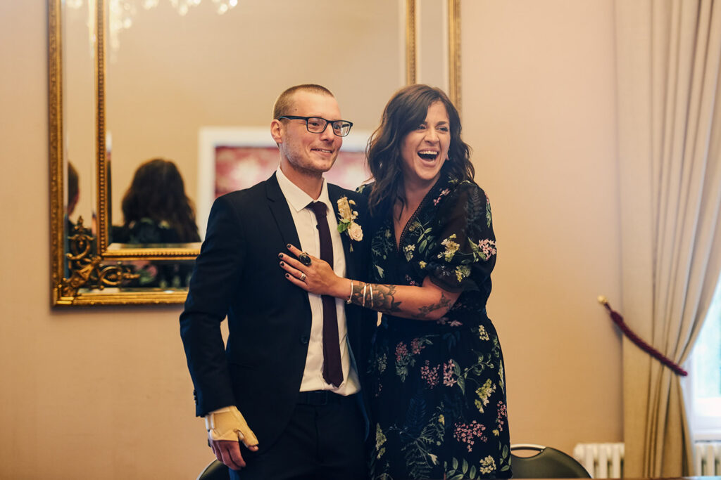 Bride and groom celebrating after their alternative registry office wedding ceremony